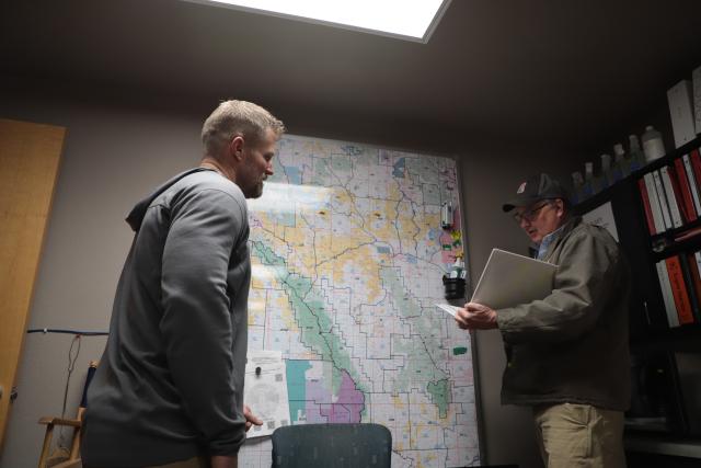 John Markalunas and Matt Norden, his Deputy Fire Management Officer, discuss the variables present in the Deer Haven prescribed burn project. (Photo courtesy of the BLM)
