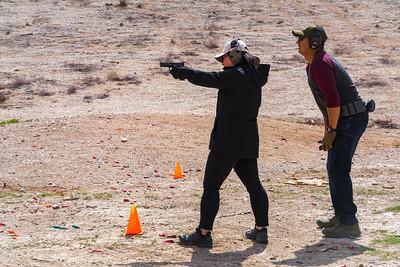 Two shooters at a range. 