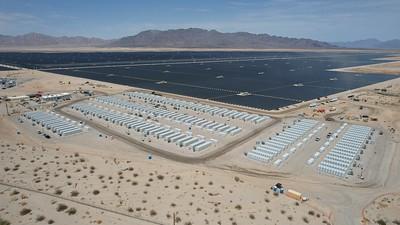 solar array in the desert with mountains in the background. 