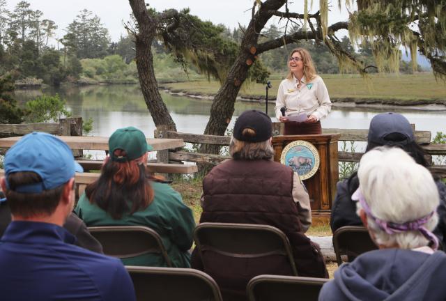 Woman speaking at a podium