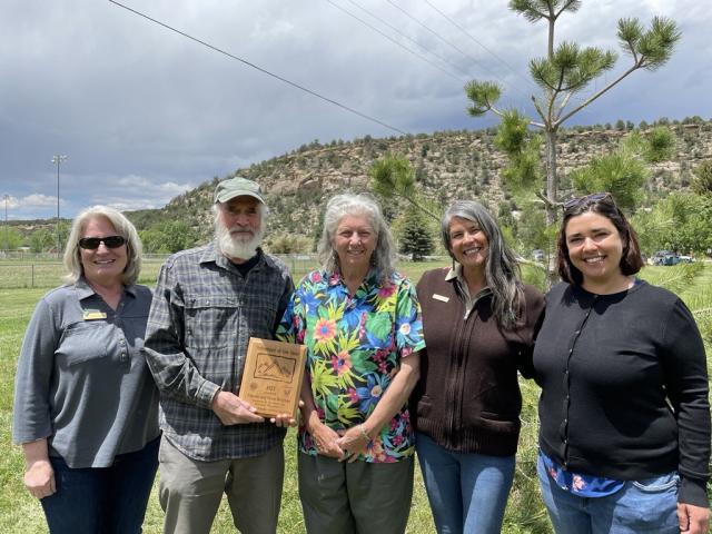 BLM Southwest District Manager Stephanie Connolly presented the BLM Colorado Volunteer of the Year Award to Peter and Marian Rohman, alongside Canyons of the Ancients park rangers Amala Posey-Monk and Anna Arsic.