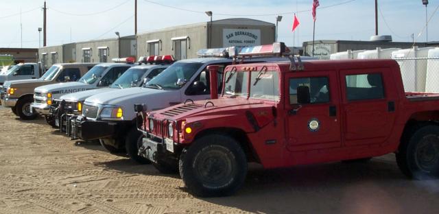 A line of trucks with the state of California seal.