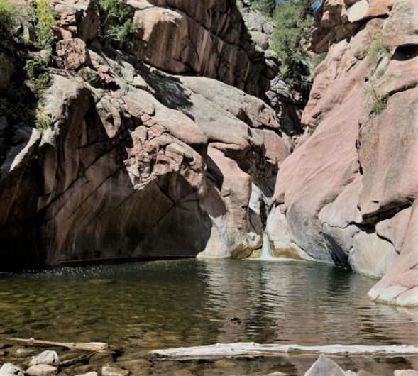 Small swimming hold between large boulders. 