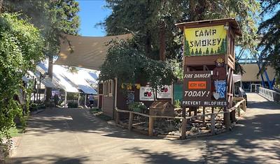 Exhibition at state fair featuring smokey the bear with a shovel