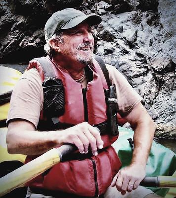 A man pilots a river raft