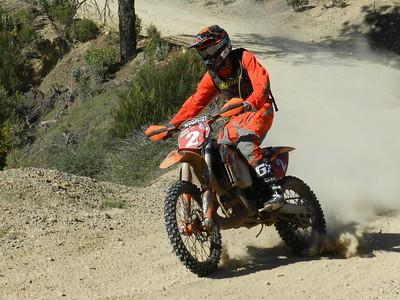 A dirt bike leans into a turn at Chappie Shasta
