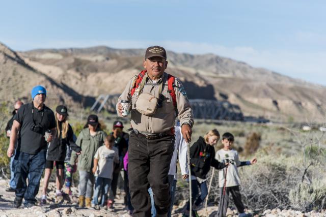 Art Basulto leads a group of kids on a desert hike.