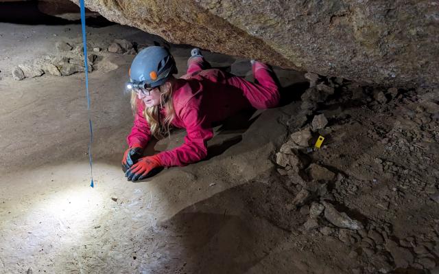 A student from Capitan Middle School crawls through a portion of Fort Stanton Cave during an educational visit to the cave at the at the Fort Stanton-Snowy River Cave National Conservation Area, Lincoln, N.M., Sept. 12.