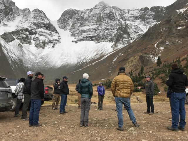 Light snow falls on members of the Southwest RAC during their October 2023 field trip.