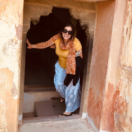 Cristina Francois peers through a doorway.