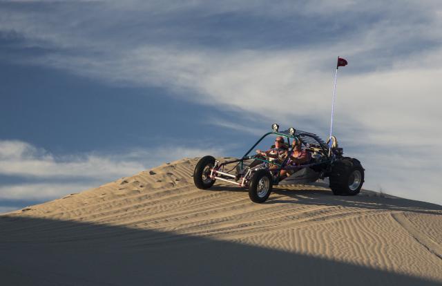 Buggy driving over Anthony Sand Dunes