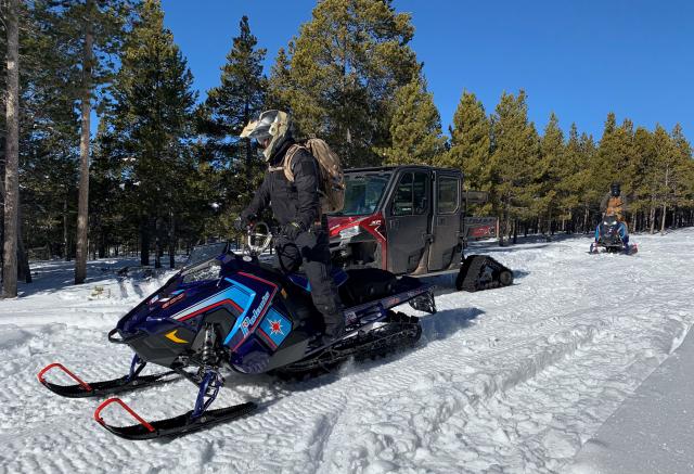 People on snow mobiles 