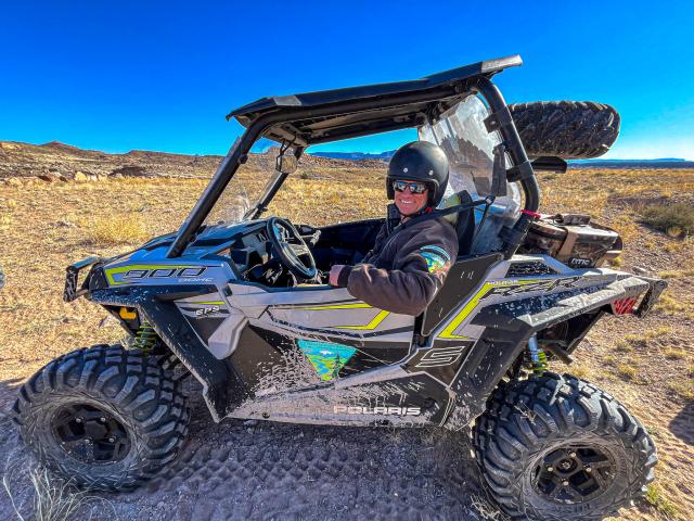 Acting Green River DM Elijah Waters April 2024 sitting in a BLM OHV.