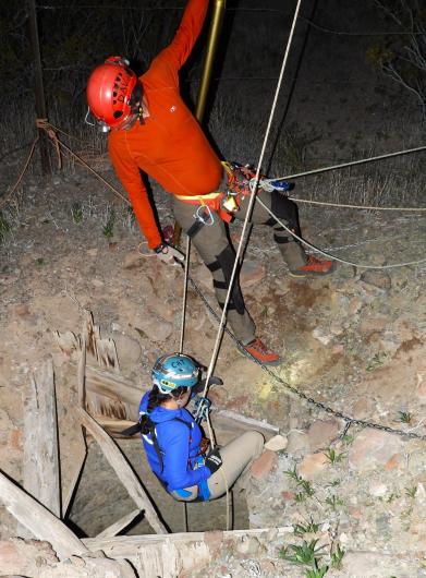 Rescuers lowering into the mineshaft