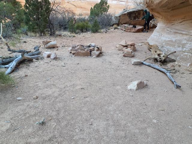 A person cleaning up a campsite.