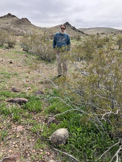 Wildlife biologist Chris Otahal and Lucky the desert tortoise