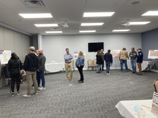 People viewing boards at Phase 5 Open House