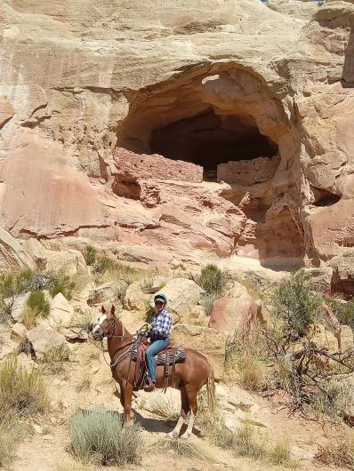 A woman rides a horse in southwest Colorado.
