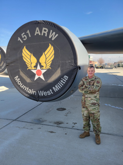 Nic standing next to aircraft