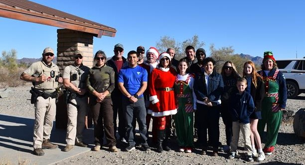 14 BLM volunteers pose for photo.