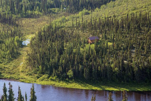 Cabin on bluff overlooking a river