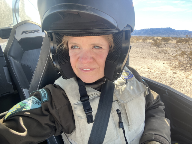 Closeup of Ranger Wostal in helmet on off-road vehicle