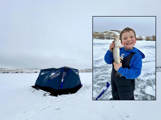 Two photos. Main photo: winter snowscape. A navy-blue-colored tent set up on a frozen lake for ice fishing. Inset photo: winter snowscape. Young boy, smiling, wearing a royal-blue-colored coat, holding up a fish with both hands.