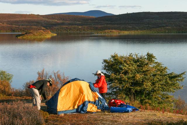 People setting up their tent at Tangle Lakes.