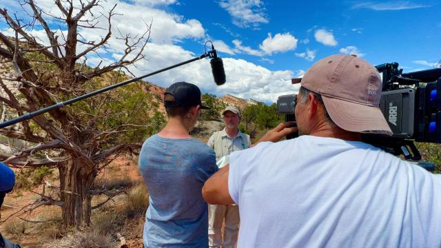 BLM employee being interviewed by a camera crew outdoors