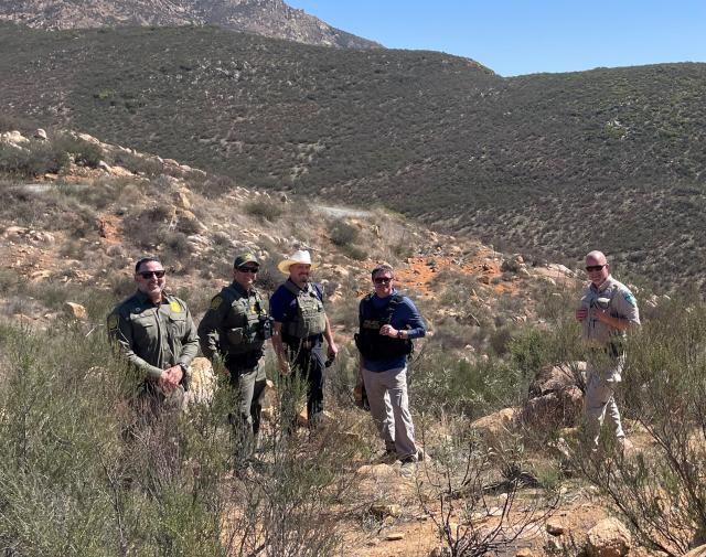 State director, Joe Stout poses with law enforcement officers.