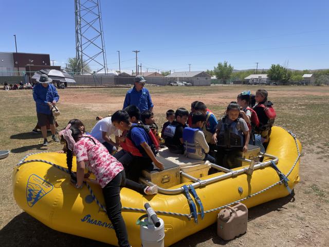 Junior Ranger Day attendees pile into a river boat.