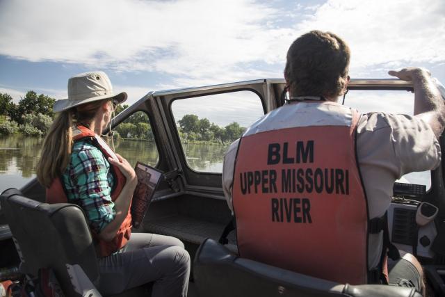 river rangers on a  boat