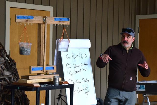A hydrologist with a model that demonstrates Lane's Balance. 