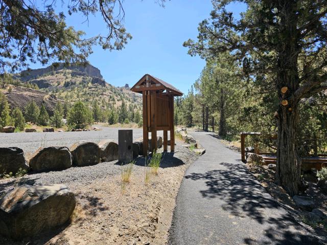 A kiosk at a campground in a scenic outdoor setting.