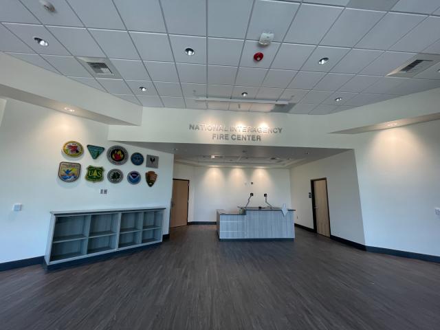 An office building lobby with welcome desk