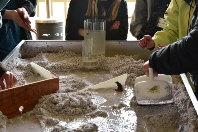 Students use the stream table at CCSC to simulate things that might impact water flow