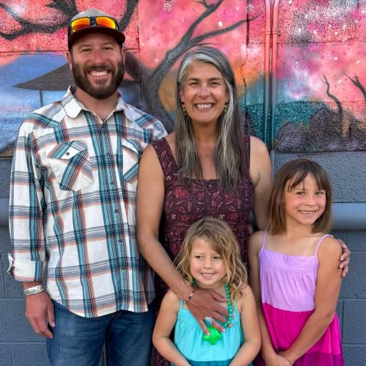 Amala, her husband, Bentley, and their two daughters, Geneva and Norah.