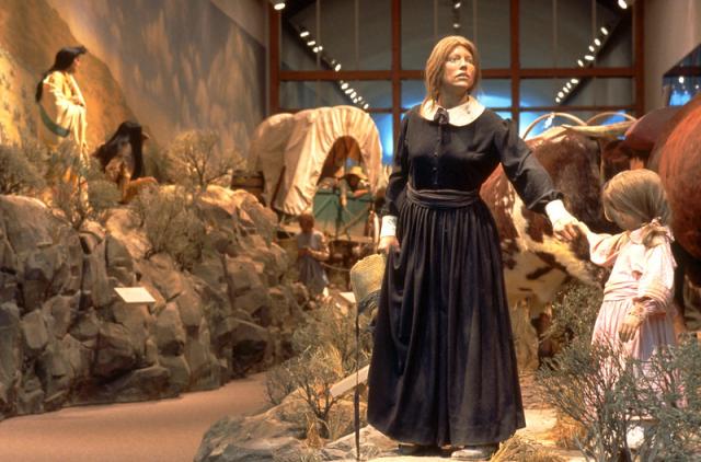 Diorama of Oregon Trail pioneer woman gazing into distance