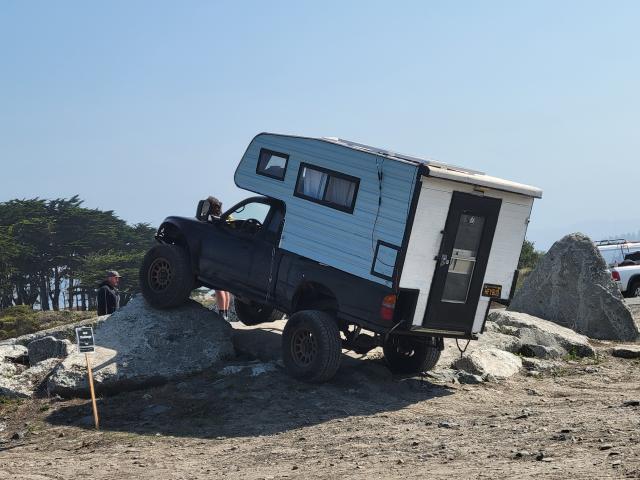A camper truck competes in a rock crawl at Samoa Dunes.