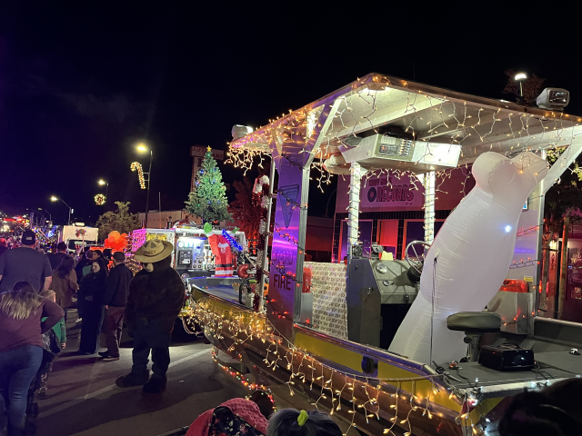 Nighttime street scene decorated in Christmas lights