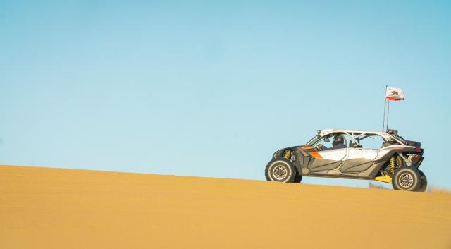 sand buggy rides over sand dune