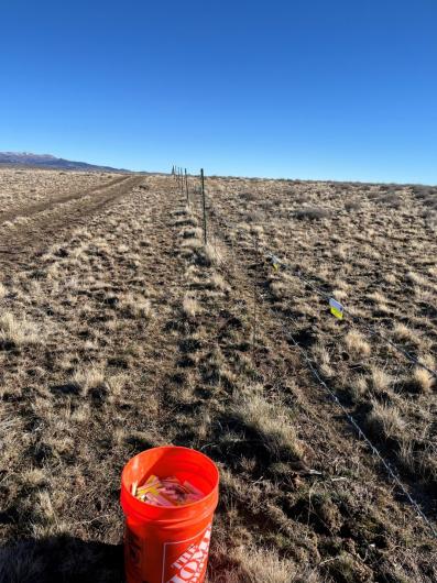 Fence markers being installed to increase fence visibility. 