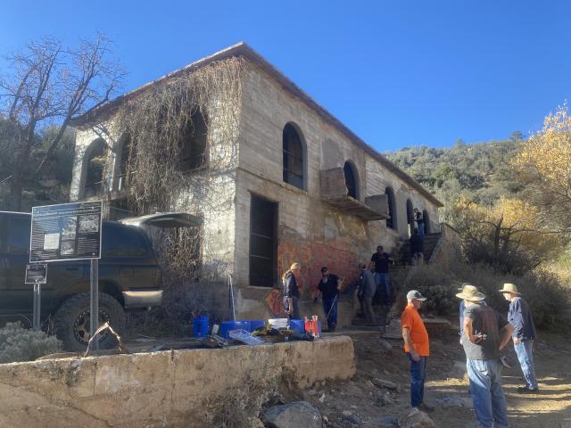 Team members plan and set up equipment for cleaning treatment.