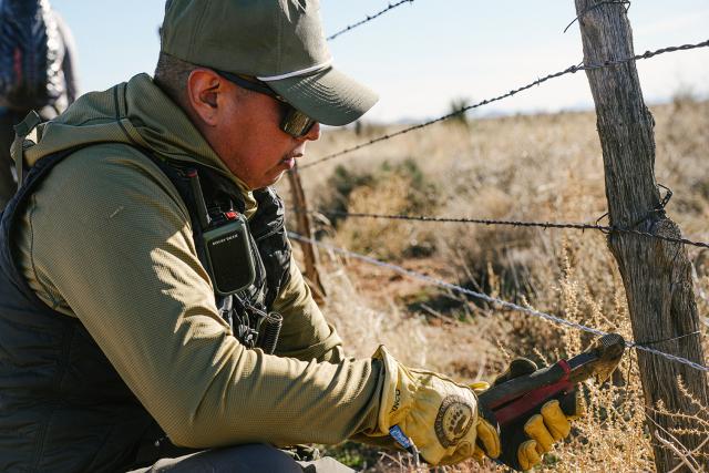 The lower strand of barbed wire was removed and replaced with a solid strand of wire 18” above the ground, designed to protect bighorn sheep. 