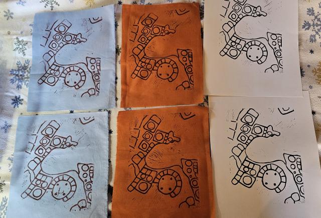 Art pieces arranged in two rows, each featuring a black lines on blue, orange, and white backgrounds.