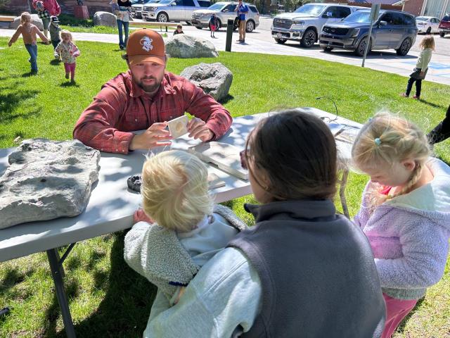 Kids get to touch fossils and a cast of a crocodile