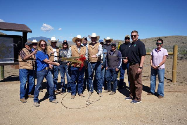 Group photo cutting the rope for the Bear Creek parking lot trailhead 