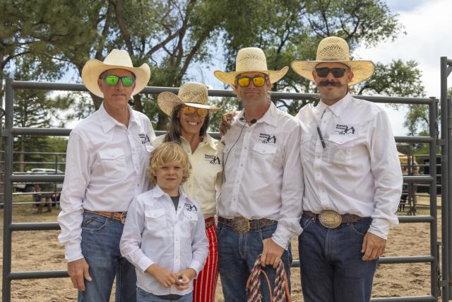 The Mantle family poses for a photo during the Bureau of Land Management's annual wild horse adoption event at Lions Park 