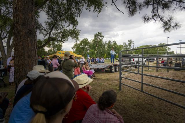 Secretary of the Interior Doug Burgum speaks before the Bureau of Land Management's annual wild horse adoption event at Lions Park during Day of the American West in Cheyenne, Wyo
