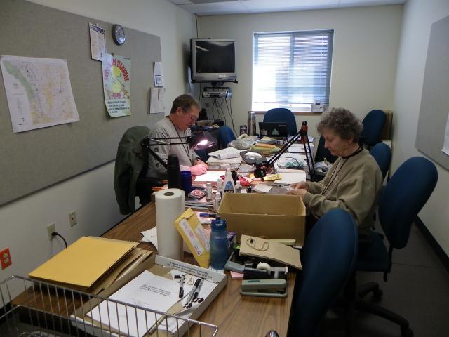 Steve Waylett and Mary Fowlkes sort artifacts for long term storage in a federal curation facility during a Passport in Time project hosted by the Bureau of Land Management Buffalo Field Office Feb. 3, 2012, in Wyoming. (BLM photo courtesy of Ardeth Hahn)